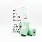 Roll of green dog poop bags with packaging on a white background